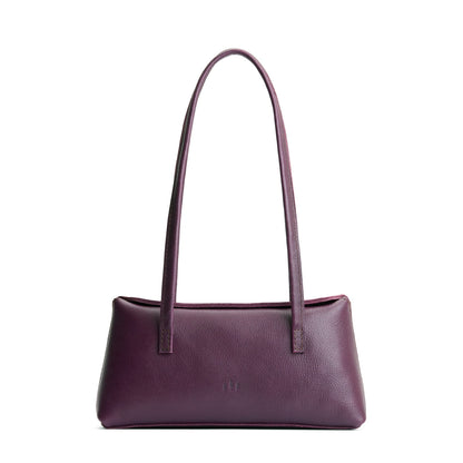 Plum | Leather bowler bag with magnetic closure against a white background