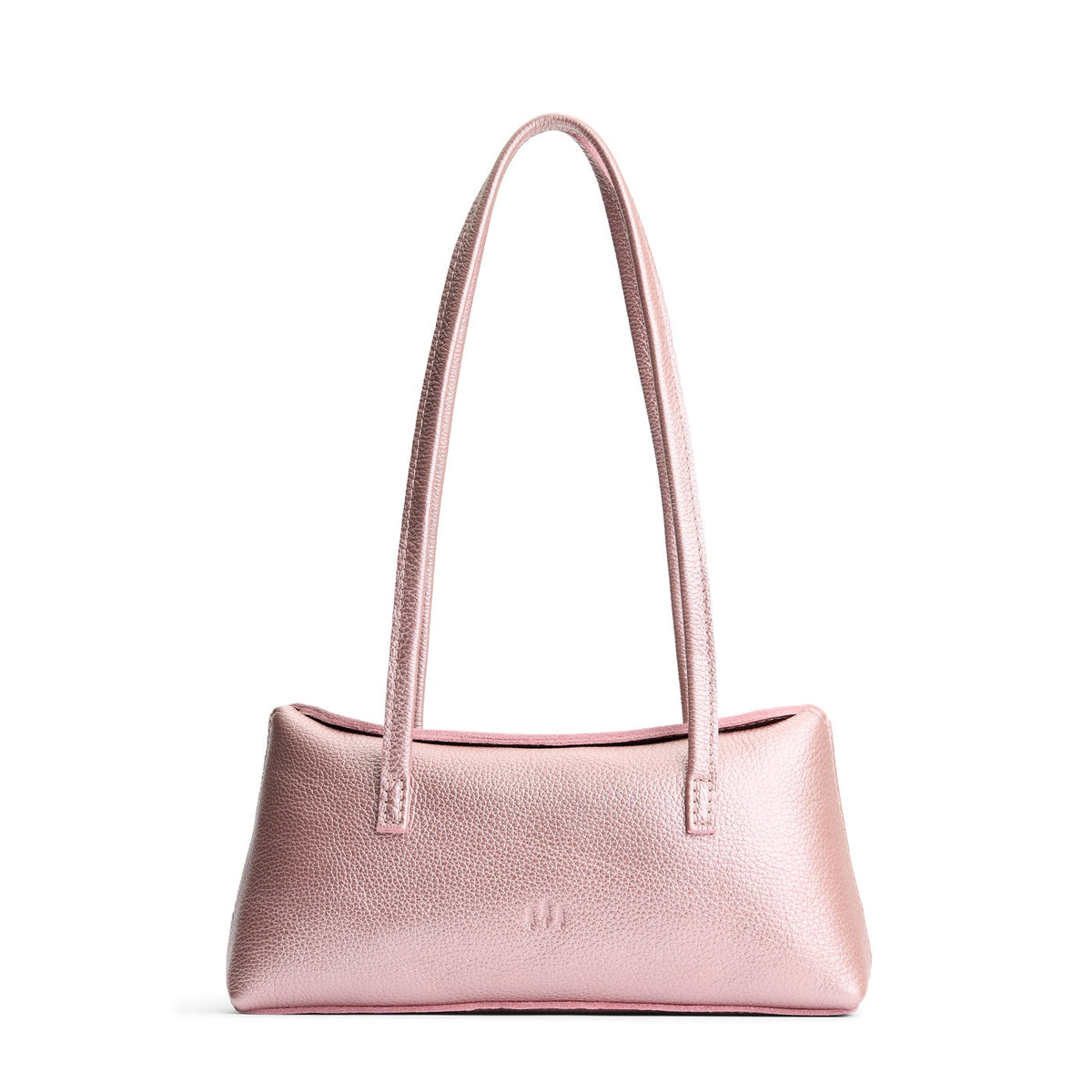 Supernova | Leather bowler bag with magnetic closure against a white background