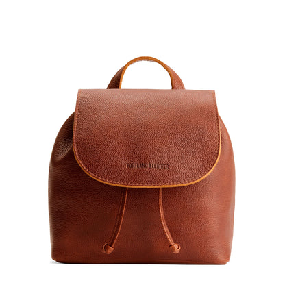 Nutmeg | Drawstring bucket backpack with snap closure under flap