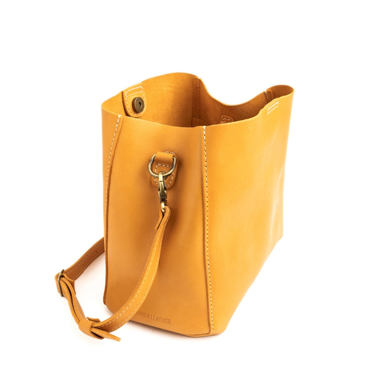 Sunflower | symmetrical bucket bag with latch closure and removable crossbody strap