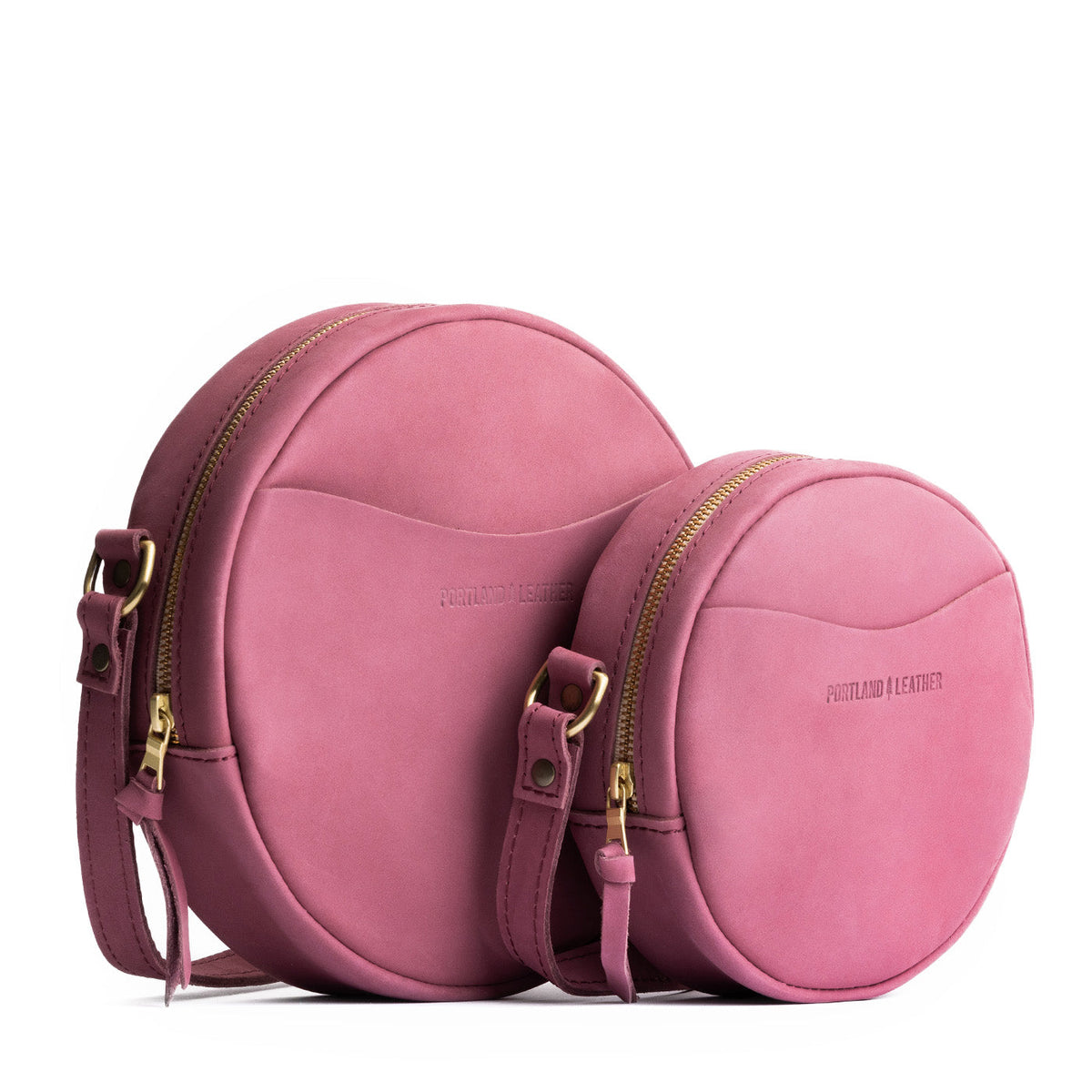 Foxglove | Size comparison image of small and large circle shaped crossbody bags with top zipper