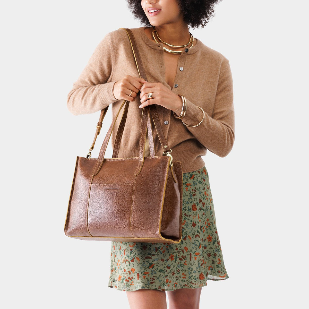 Asheville*East/West | Model wearing structured wide tote bag with overlapping panels and crossbody strap