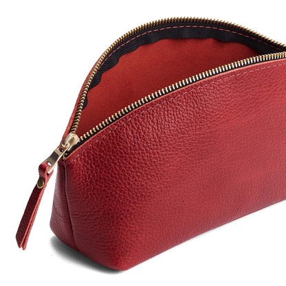 Chili Red | Spacious leather makeup bag with curved seams and top zipper