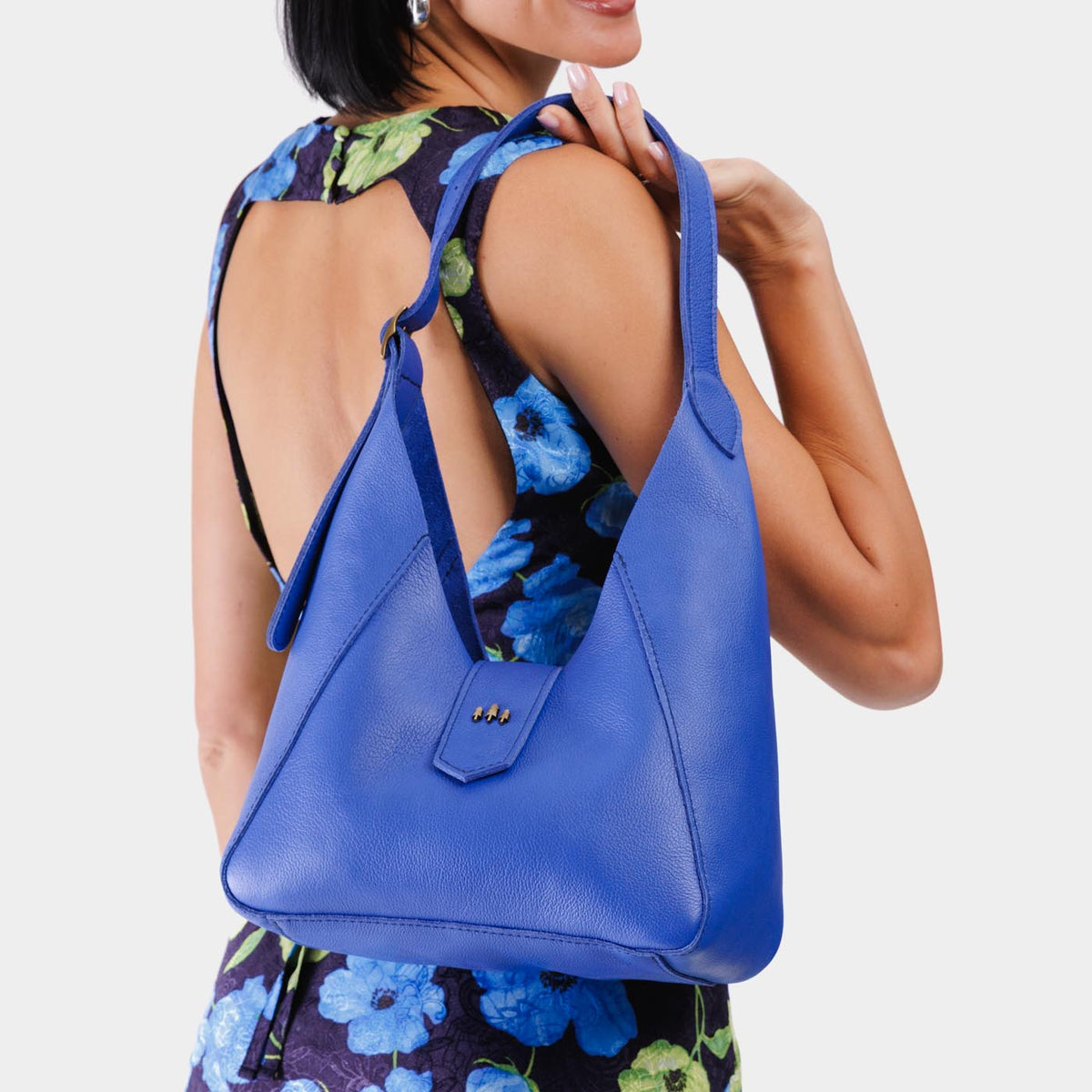 Astro Blue | Model wearing structured hobo shoulder bag with adjustable strap and magnetic closure