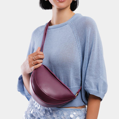 Lollipop*Small | Model wearing petite half circle shaped sling bag