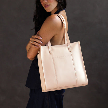 Moonflower*North/South | Model wearing structured large tote bag with overlapping panels and crossbody strap