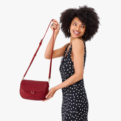 Chili Red*Large | Model wearing a leather Crossbody with a flap and magnetic closure