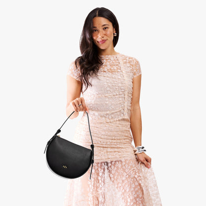 Black | Model wearing a rounded structured shoulder bag