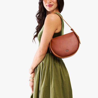 Chestnut | Model wearing a rounded structured shoulder bag