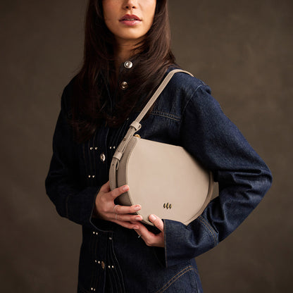Dragon Bone | Model wearing a rounded structured shoulder bag