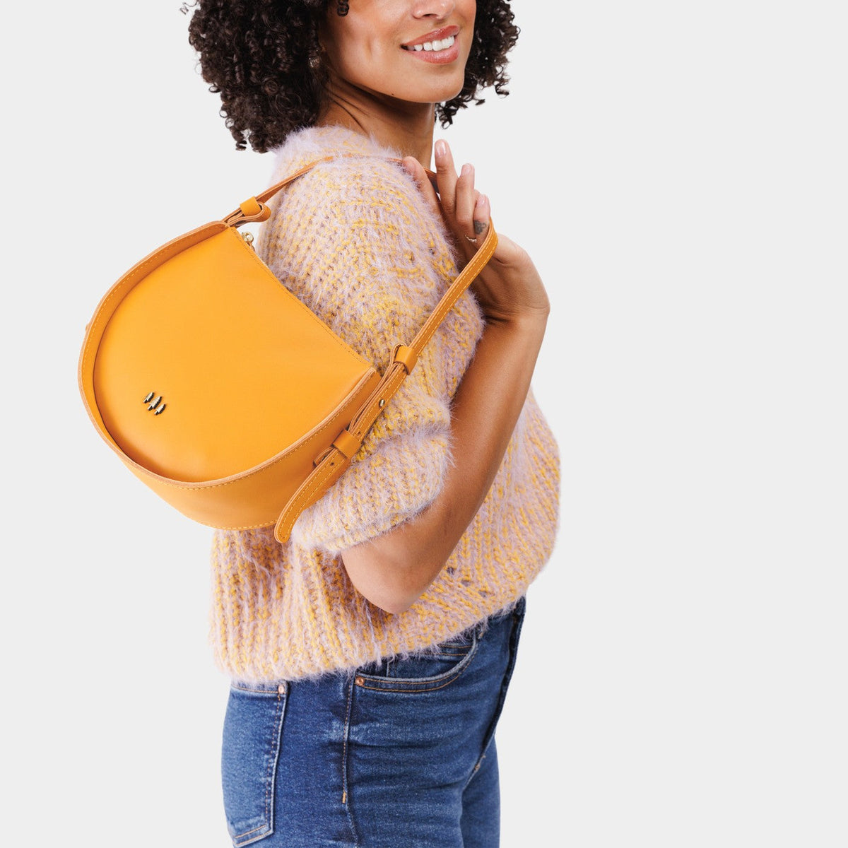 Sunflower | Model wearing a rounded structured shoulder bag