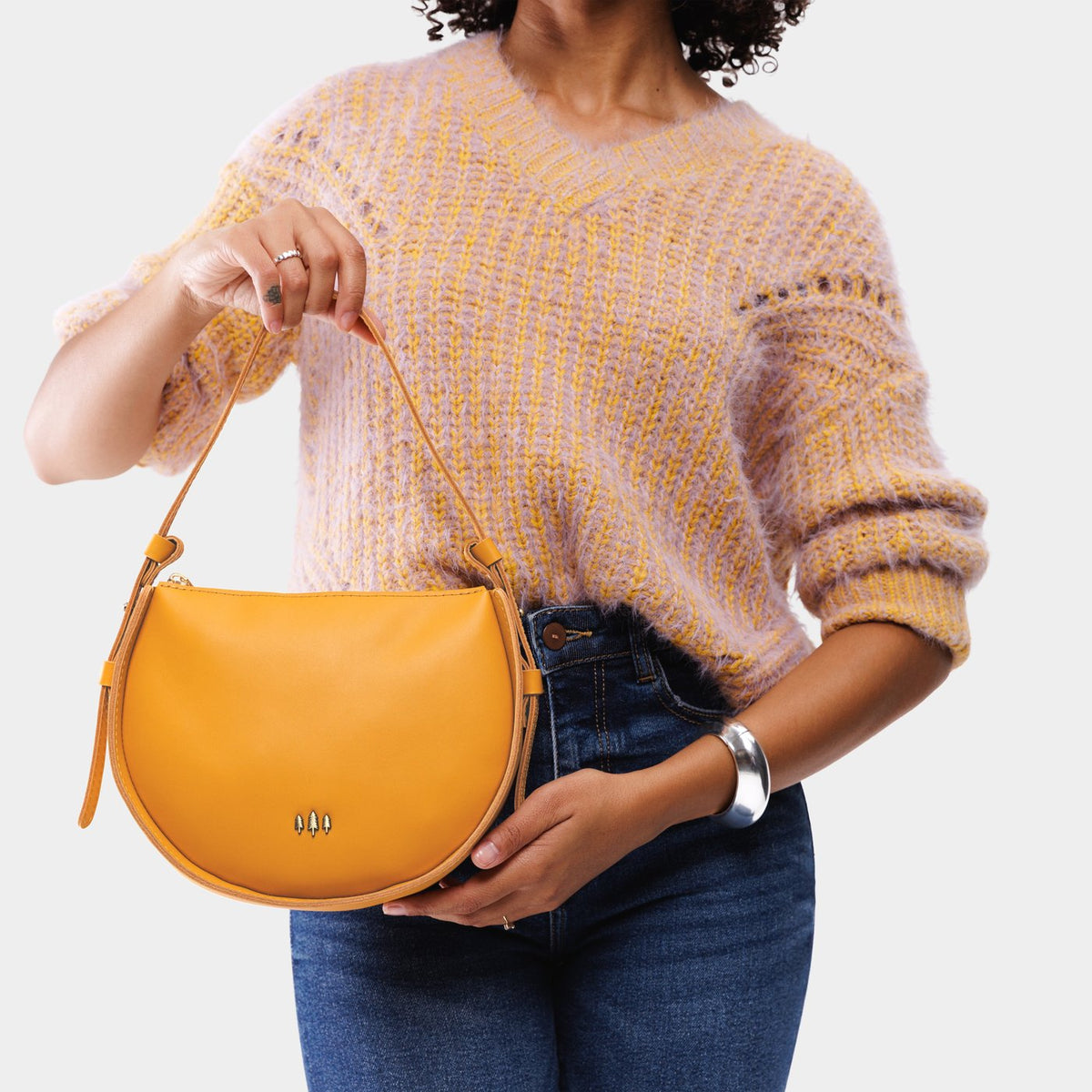 Sunflower | Model wearing a rounded structured shoulder bag