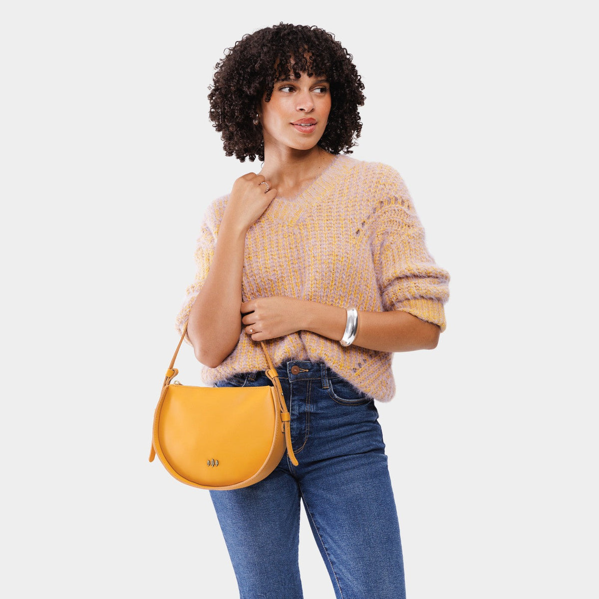 Sunflower | Model wearing a rounded structured shoulder bag
