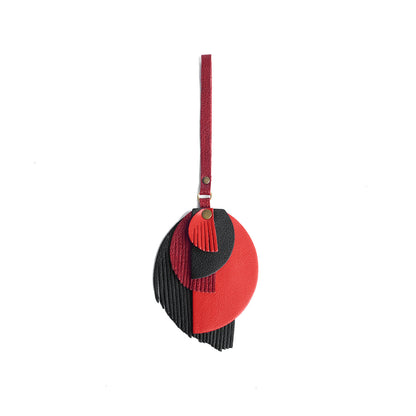 Poison | Intricately cut leather shapes and fringe
