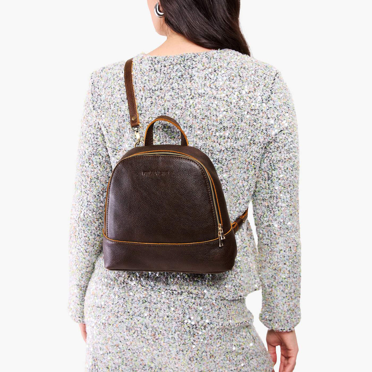 Coldbrew | Model wearing leather backpack with debossed Portland Leather logo on front