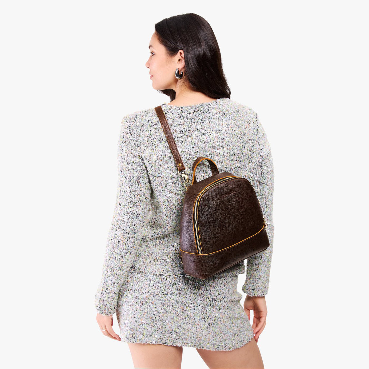 Coldbrew | Model wearing leather backpack sling bag style