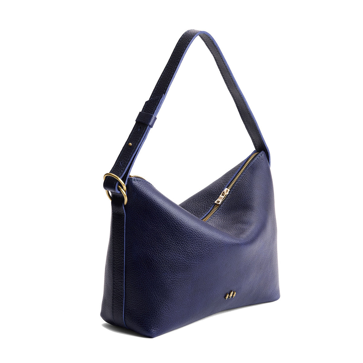 Cobalt*Large | Model Wearing medium sized slouchy leather shoulder bag with zipper opening and three metal tree emblems