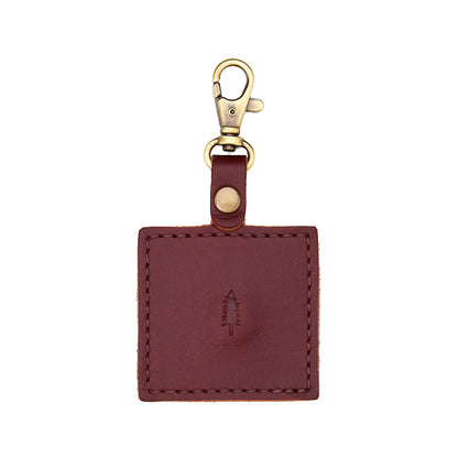 Cognac | Square-shaped leather AirTag holder with snap closure and swivel lobster claw clasp
