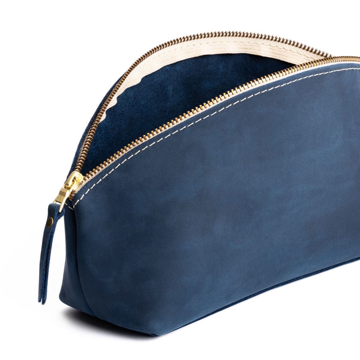 Deep Water | Spacious leather makeup bag with curved seams and top zipper open